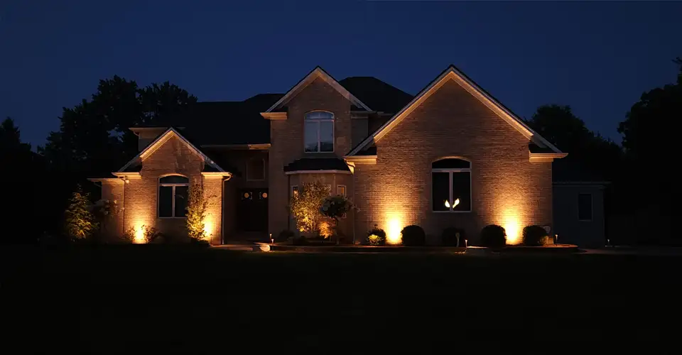 house exterior at night featuring outdoor lighting